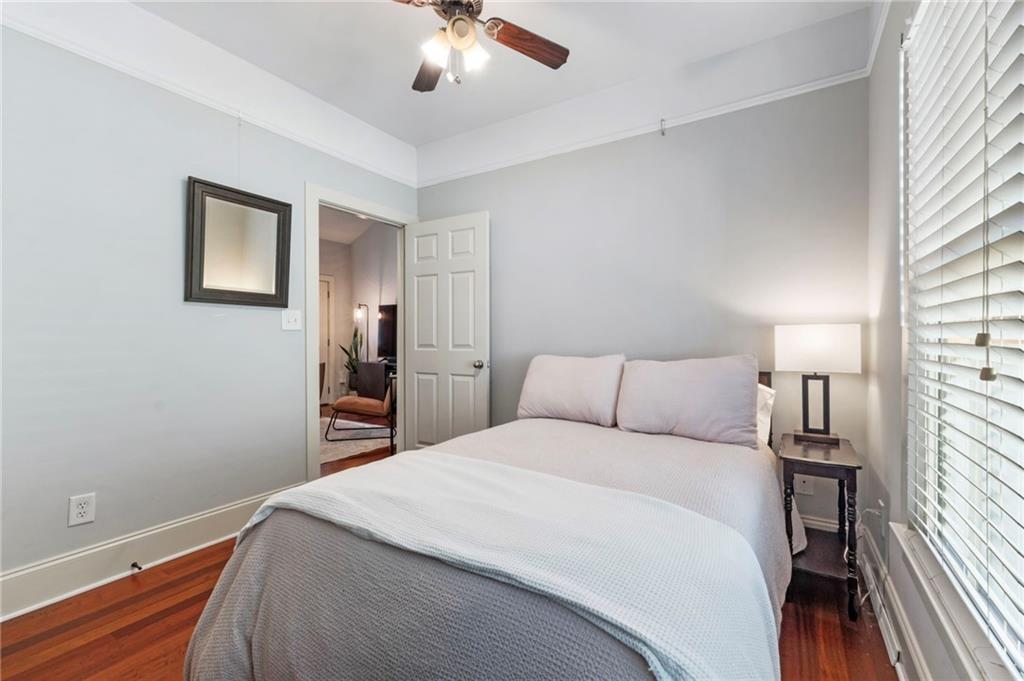 173 Berean Avenue Southeast Atlanta, GA 30316 - Photo 45 of 61 a bedroom with a bed and a chandelier