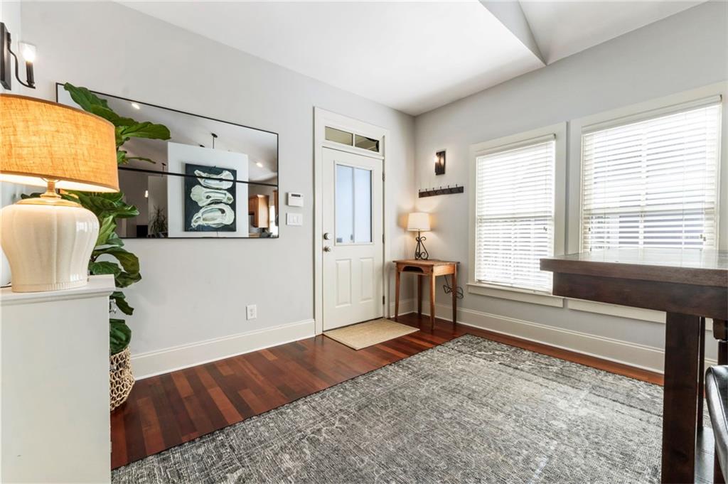 173 Berean Avenue Southeast Atlanta, GA 30316 - Photo 9 of 61 a bedroom with a bed and large windows