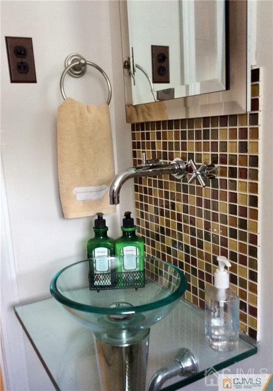 24 Rath Lane East Brunswick, NJ 08816 - Photo 13 of 25 a bathroom with a sink and a mirror