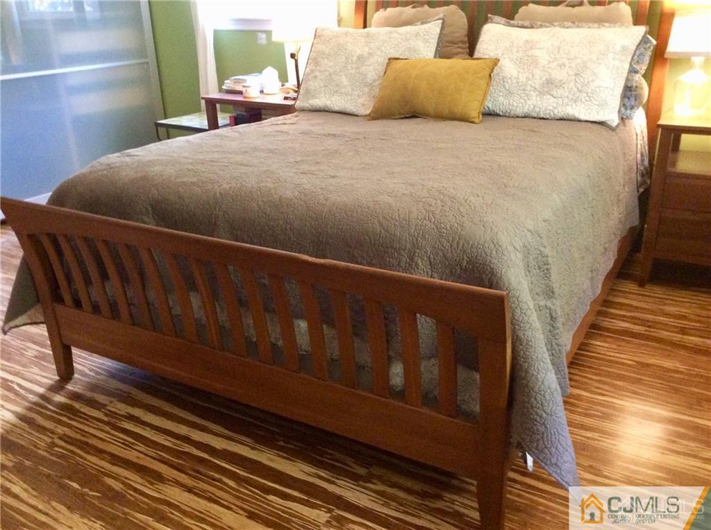 24 Rath Lane East Brunswick, NJ 08816 - Photo 15 of 25 a bed sitting in a bedroom next to a window