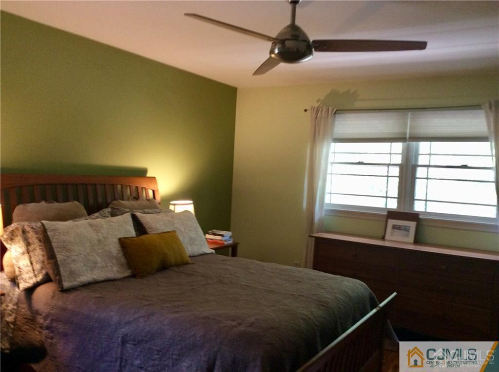 24 Rath Lane East Brunswick, NJ 08816 - Photo 16 of 25 a bedroom with a bed and a window