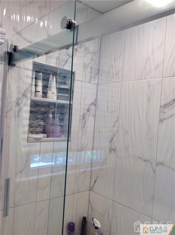 24 Rath Lane East Brunswick, NJ 08816 - Photo 17 of 25 a bathroom with a shower