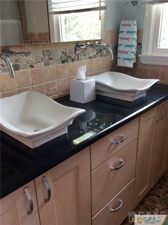 24 Rath Lane East Brunswick, NJ 08816 - Photo 21 of 25 a bathroom with a sink and a window