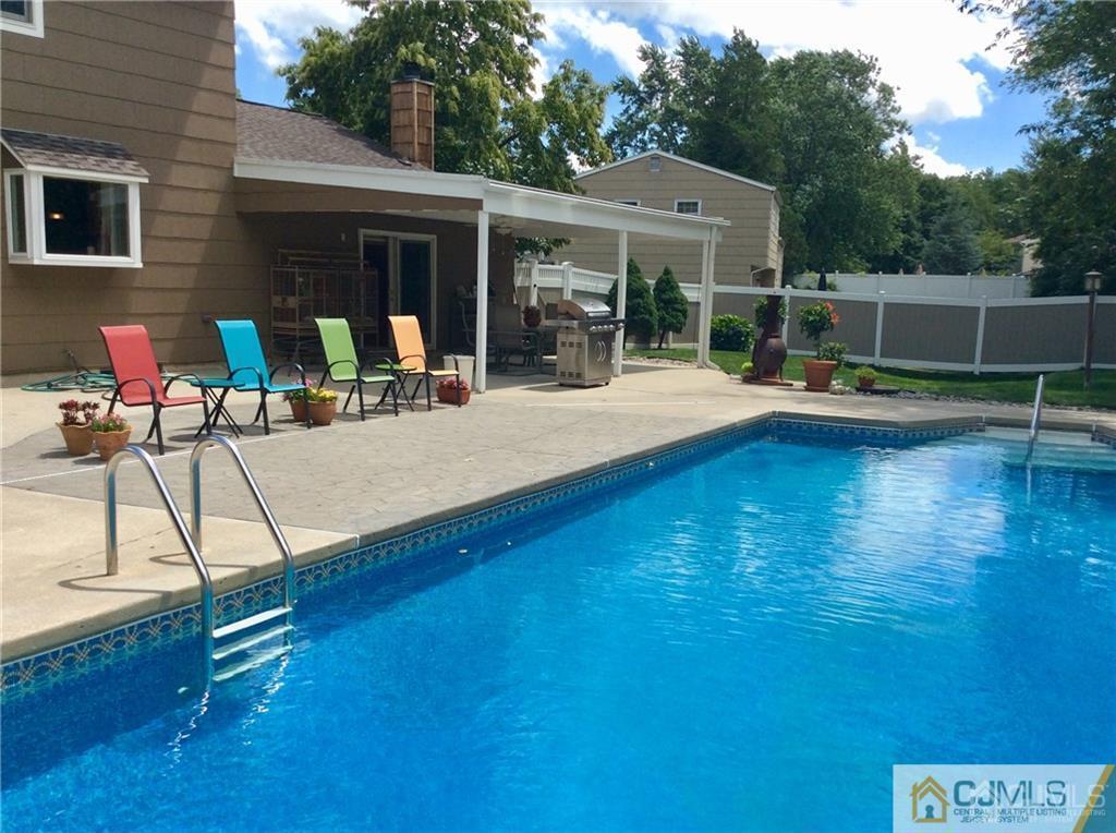 24 Rath Lane East Brunswick, NJ 08816 - Photo 22 of 25 a view of a swimming pool with a patio
