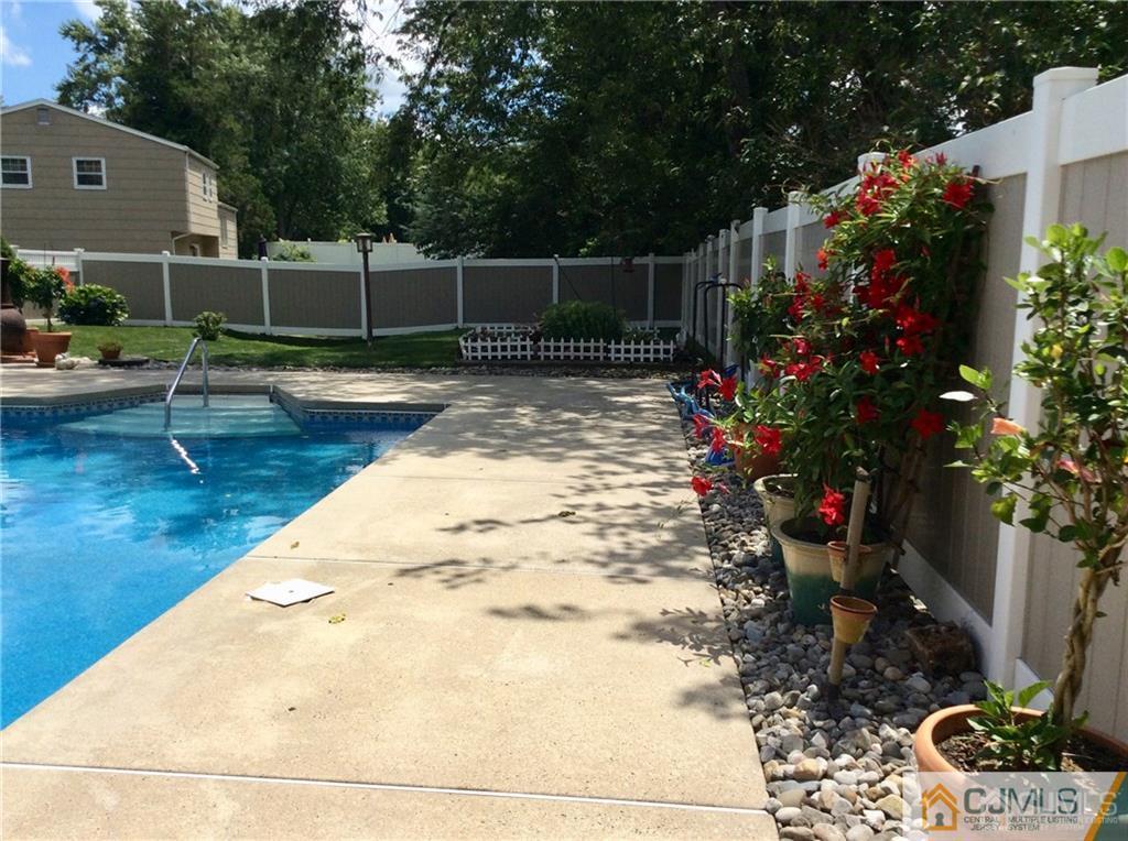 24 Rath Lane East Brunswick, NJ 08816 - Photo 23 of 25 a view of swimming pool with sitting area