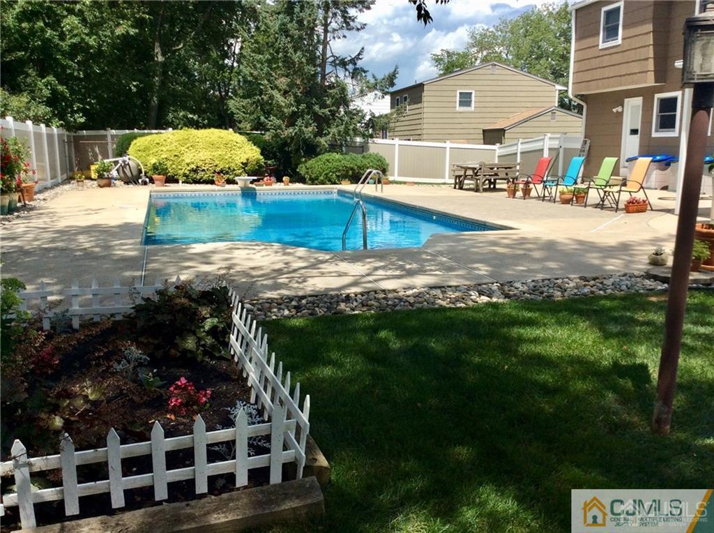 24 Rath Lane East Brunswick, NJ 08816 - Photo 24 of 25 a view of a house with backyard and sitting area