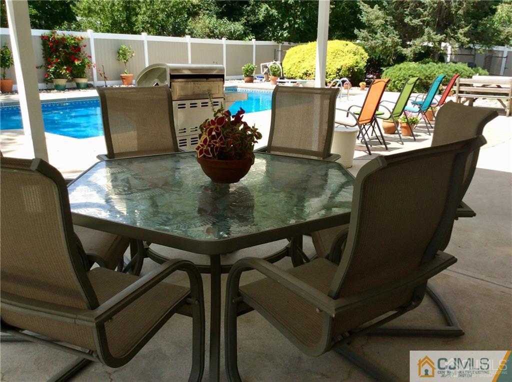 24 Rath Lane East Brunswick, NJ 08816 - Photo 25 of 25 a view of a chairs and table in the terrace