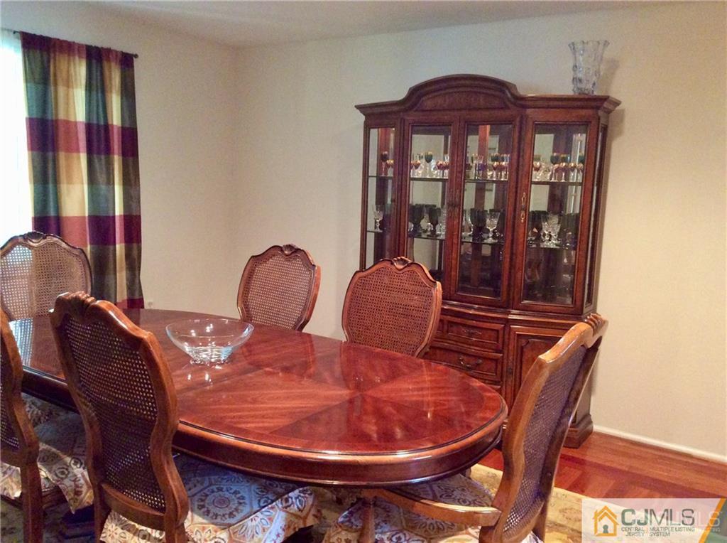 24 Rath Lane East Brunswick, NJ 08816 - Photo 5 of 25 a dining room with furniture and wooden floor