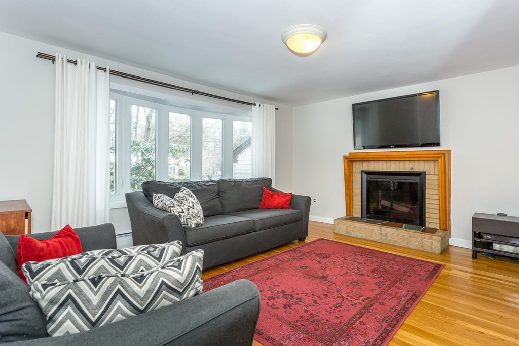 7 Hampton Road Sharon, MA 02067 - Photo 3 of 18 a living room with furniture and a fireplace