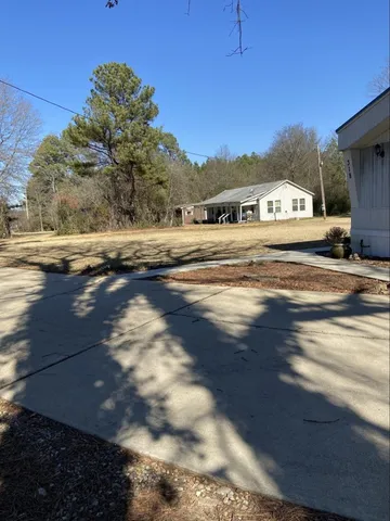 a view of street with parked cars