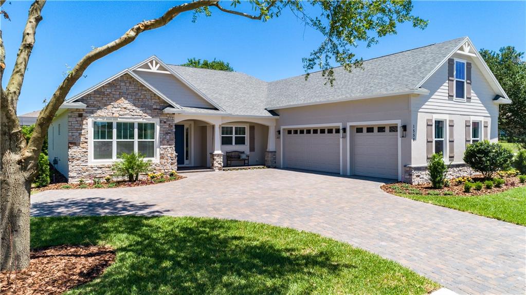 The beautiful stone accents, brick paver driveway and coordinating color tones represent what is currently planned for this fabulous custom home. The model being built here in Palma Ceia does not include a bonus room over (shown here on THE STONE CREST II) over the garage.  See next photo for that version.