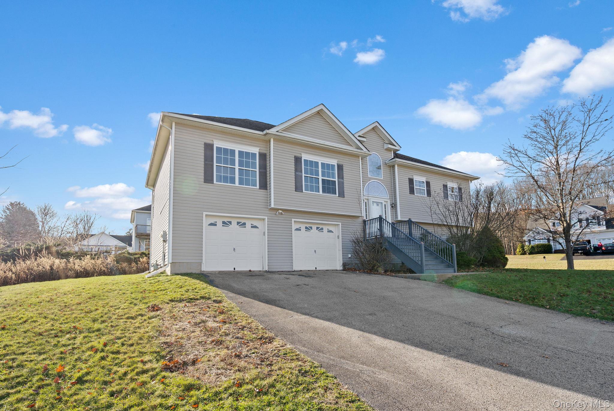 17 Carmella Road Highland, NY 12528 - Photo 2 of 48 Bi-level home featuring a front lawn, a garage, and driveway
