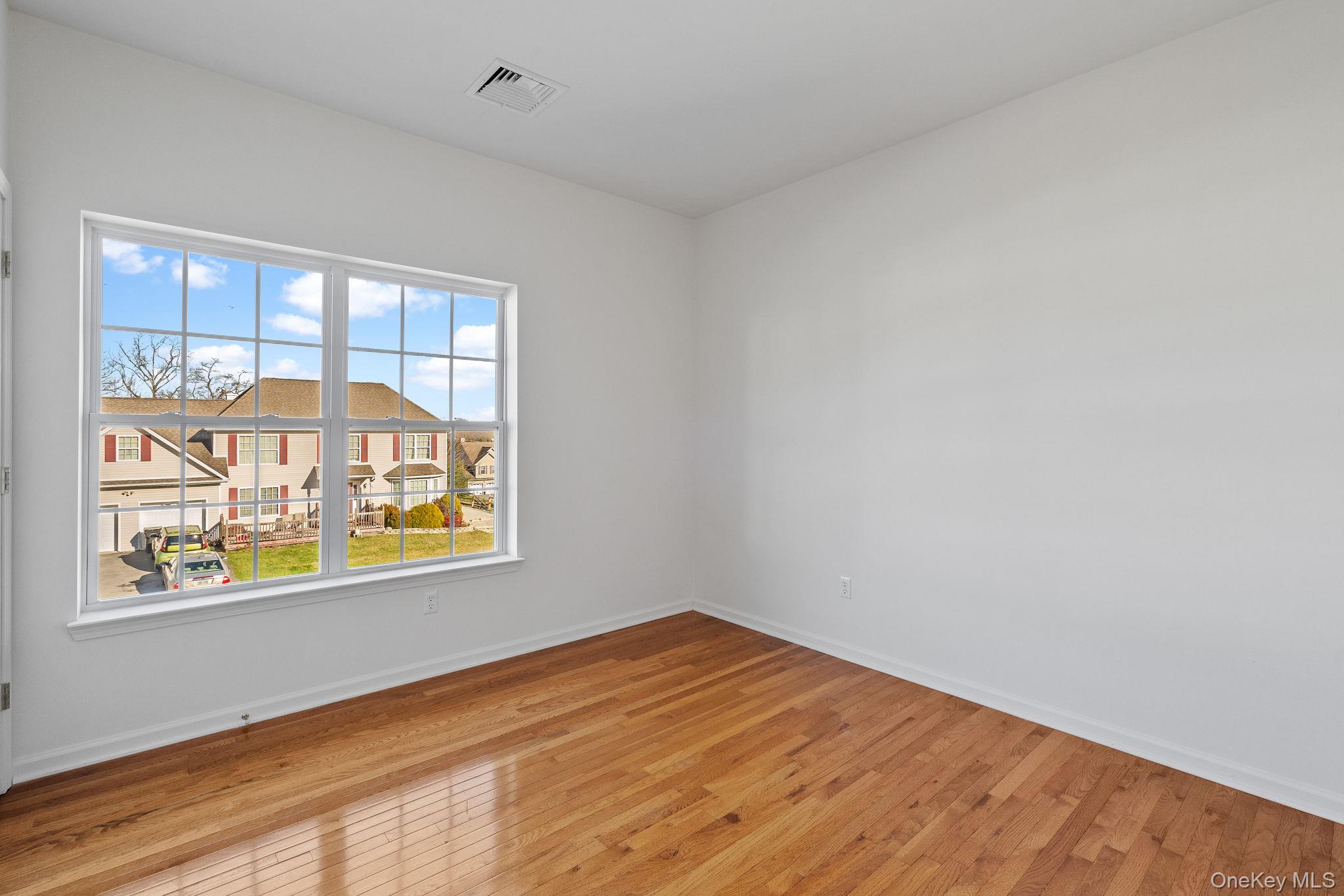 17 Carmella Road Highland, NY 12528 - Photo 23 of 48 Unfurnished room with wood-type flooring and a residential view