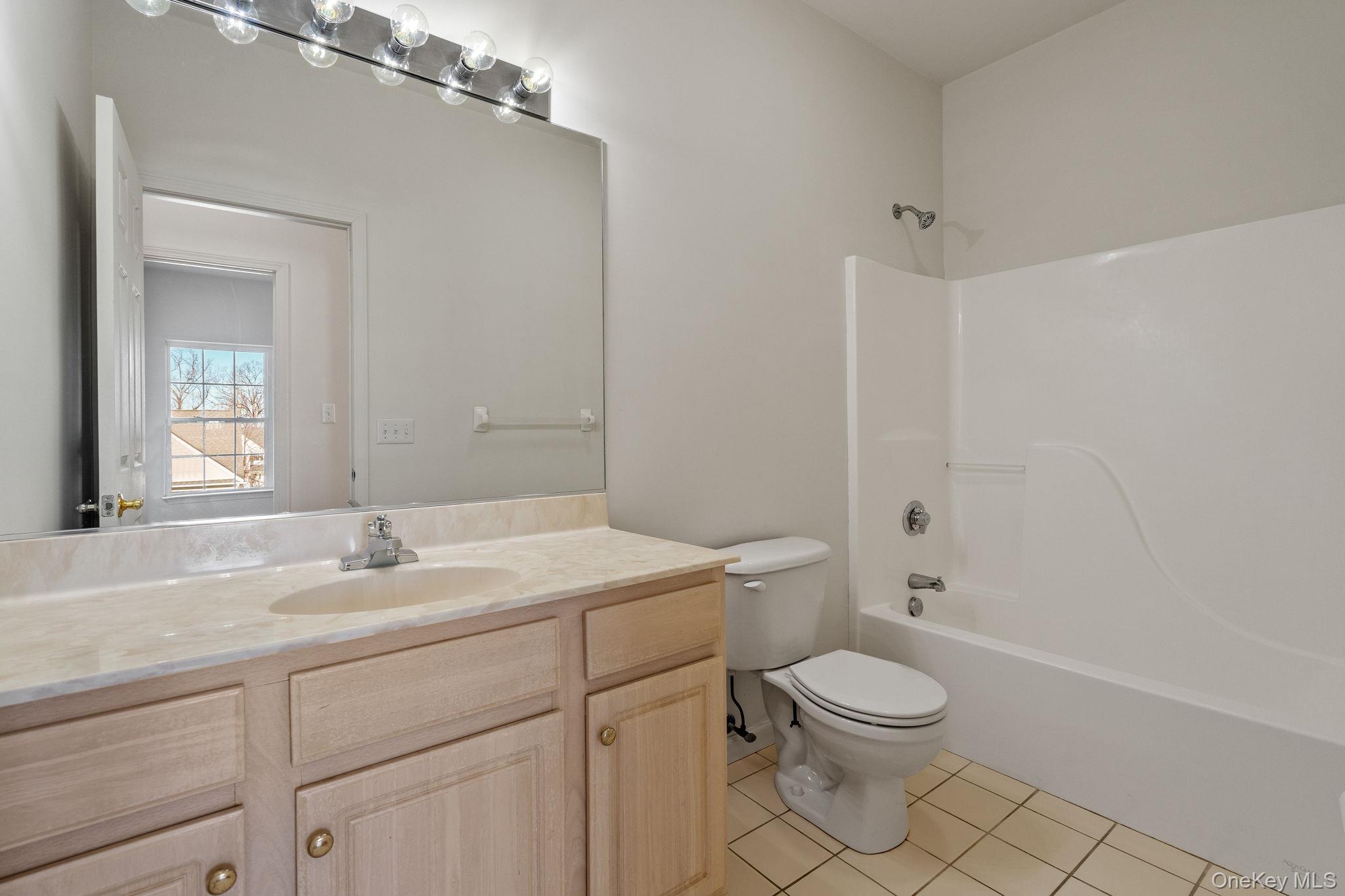 17 Carmella Road Highland, NY 12528 - Photo 25 of 48 Bathroom featuring vanity, tub / shower combination, and light tile patterned floors