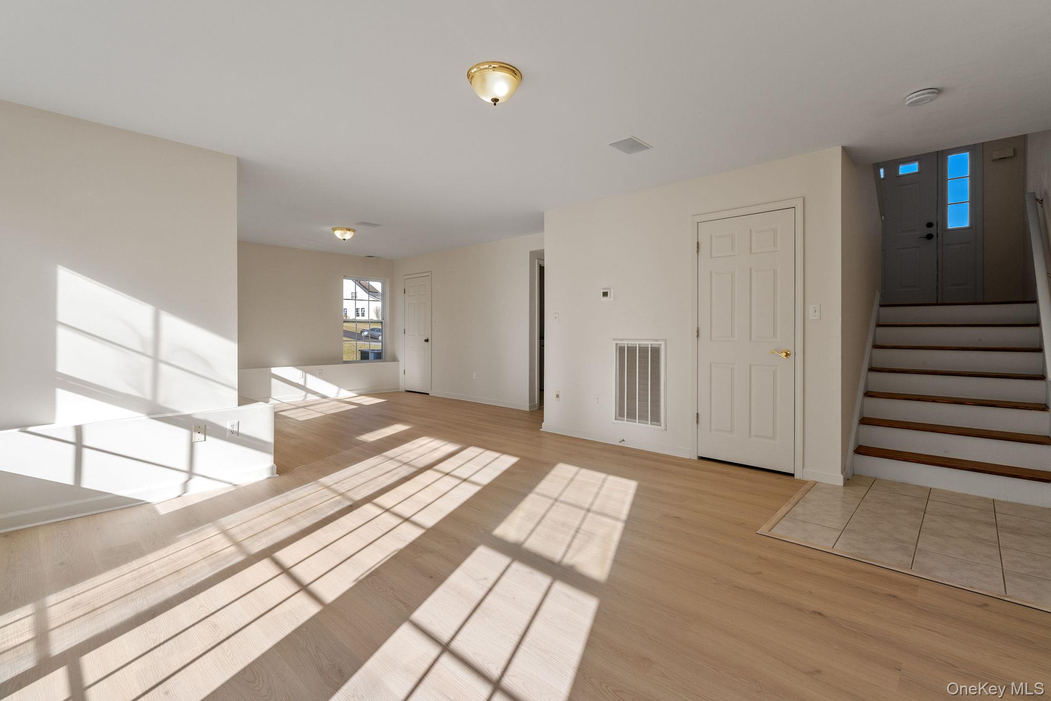 17 Carmella Road Highland, NY 12528 - Photo 34 of 48 Unfurnished room featuring light wood-style floors and stairway