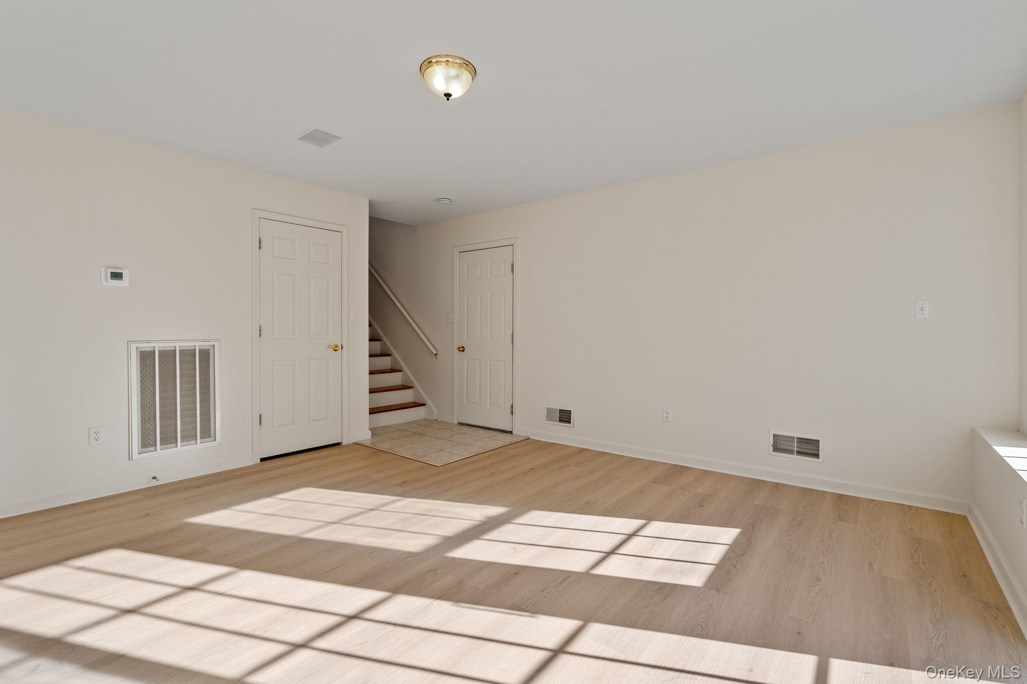 17 Carmella Road Highland, NY 12528 - Photo 35 of 48 Unfurnished room featuring light wood-type flooring and stairway