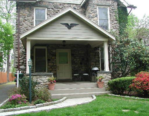 35 Maple Tree Avenue, Unit 6 Stamford, CT 06906 - Photo 1 of 1 a front view of a house with garden
