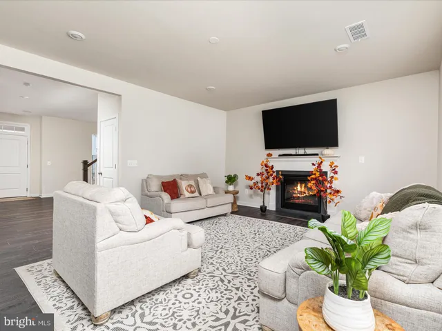 a spacious bedroom with a bed and a couch