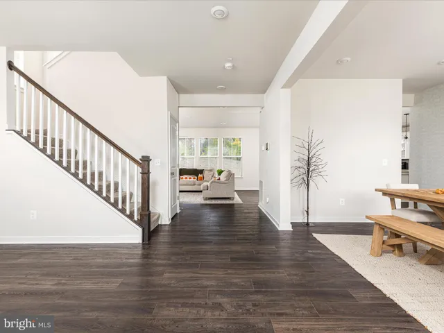 a view of a workspace with furniture and window