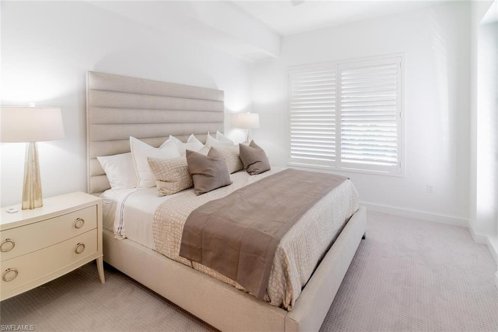 1125 Central Avenue, Unit 373 Naples, FL 34102 - Photo 15 of 49 a bedroom with a bed and a window