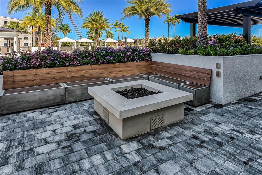 1125 Central Avenue, Unit 373 Naples, FL 34102 - Photo 40 of 49 a view of a backyard with a sitting area