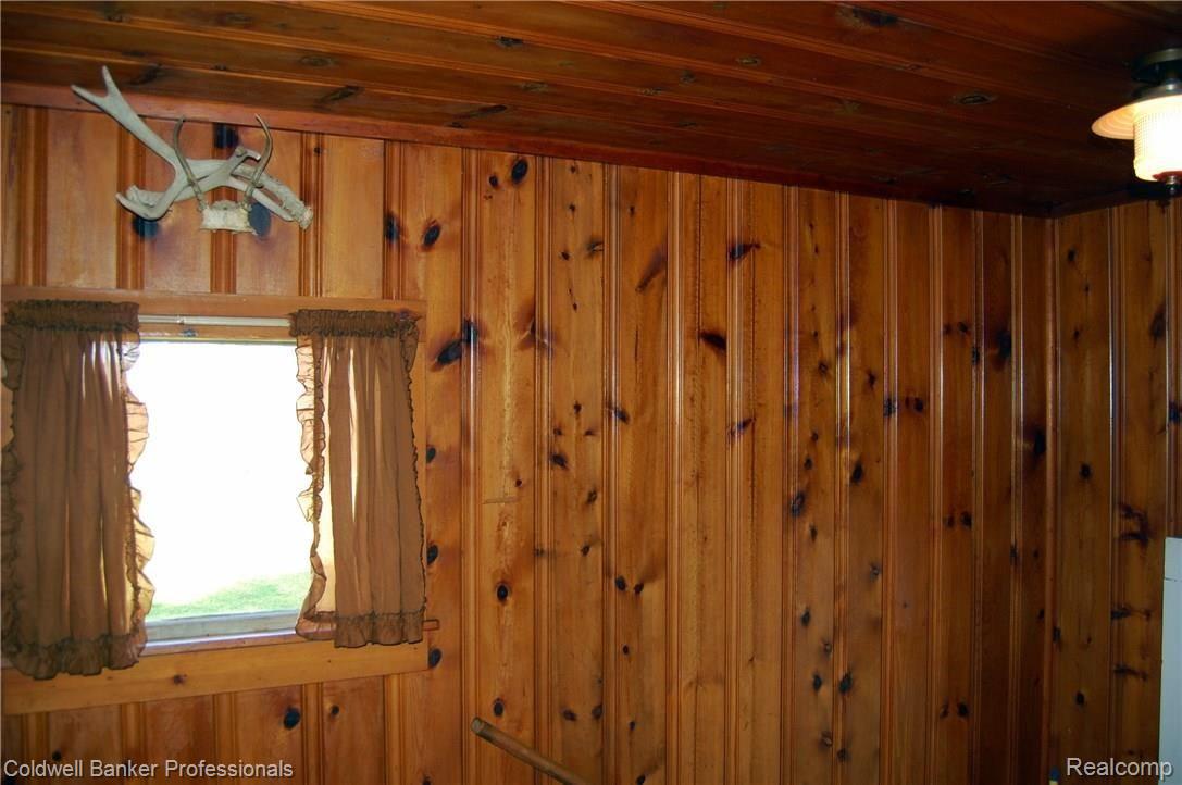 28734 West Road New Boston, MI 48164 - Photo 20 of 26 Knotty Pine back porch