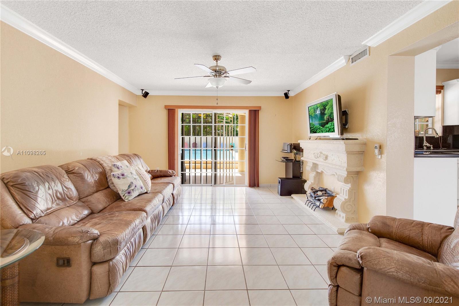 620 Southwest 22nd Road Miami, FL 33129 - Photo 11 of 53 a living room with furniture and a flat screen tv