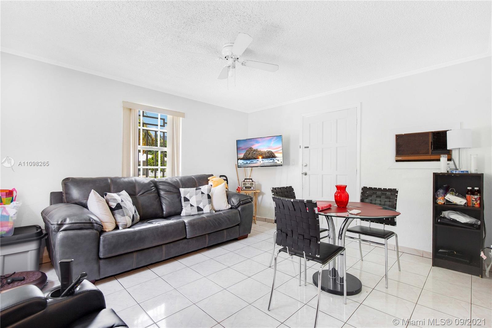 620 Southwest 22nd Road Miami, FL 33129 - Photo 12 of 53 a living room with furniture and a flat screen tv