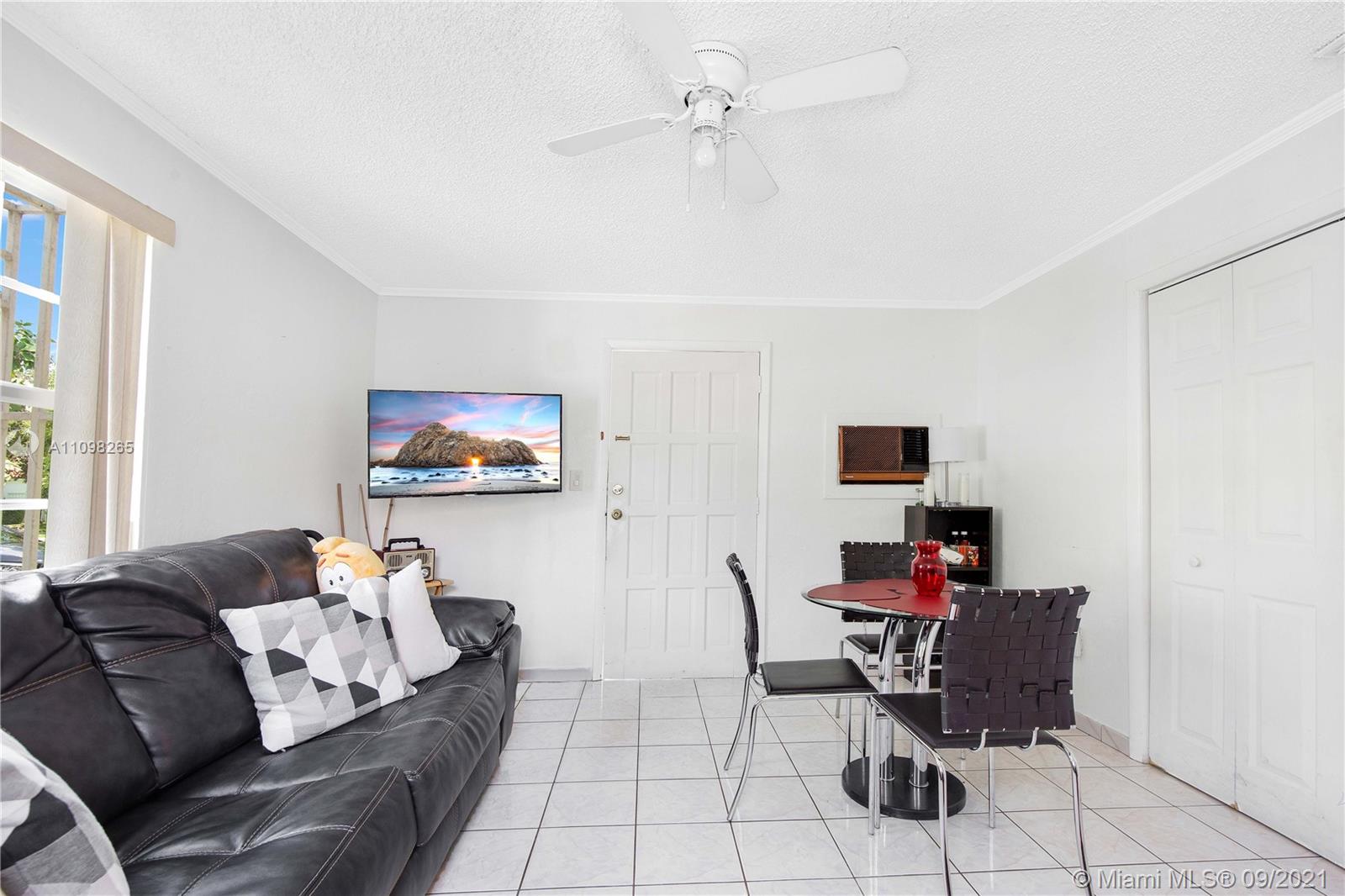 620 Southwest 22nd Road Miami, FL 33129 - Photo 13 of 53 a living room with furniture and a flat screen tv