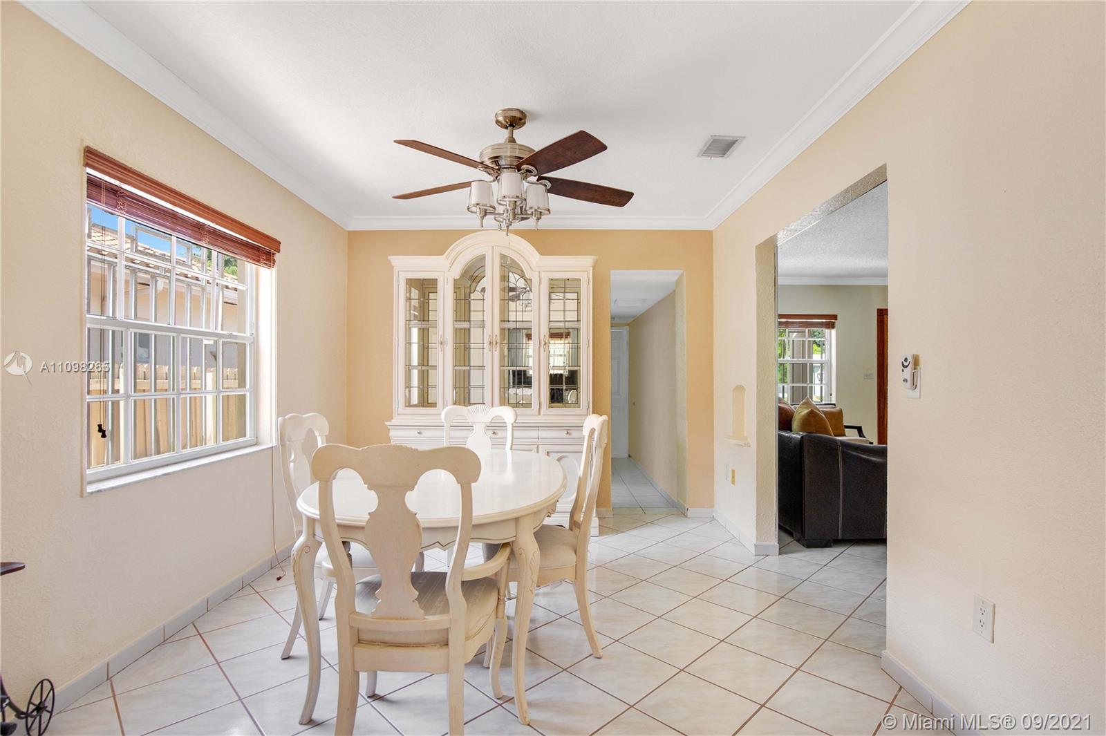 620 Southwest 22nd Road Miami, FL 33129 - Photo 22 of 53 a view of a dining room with furniture and chandelier