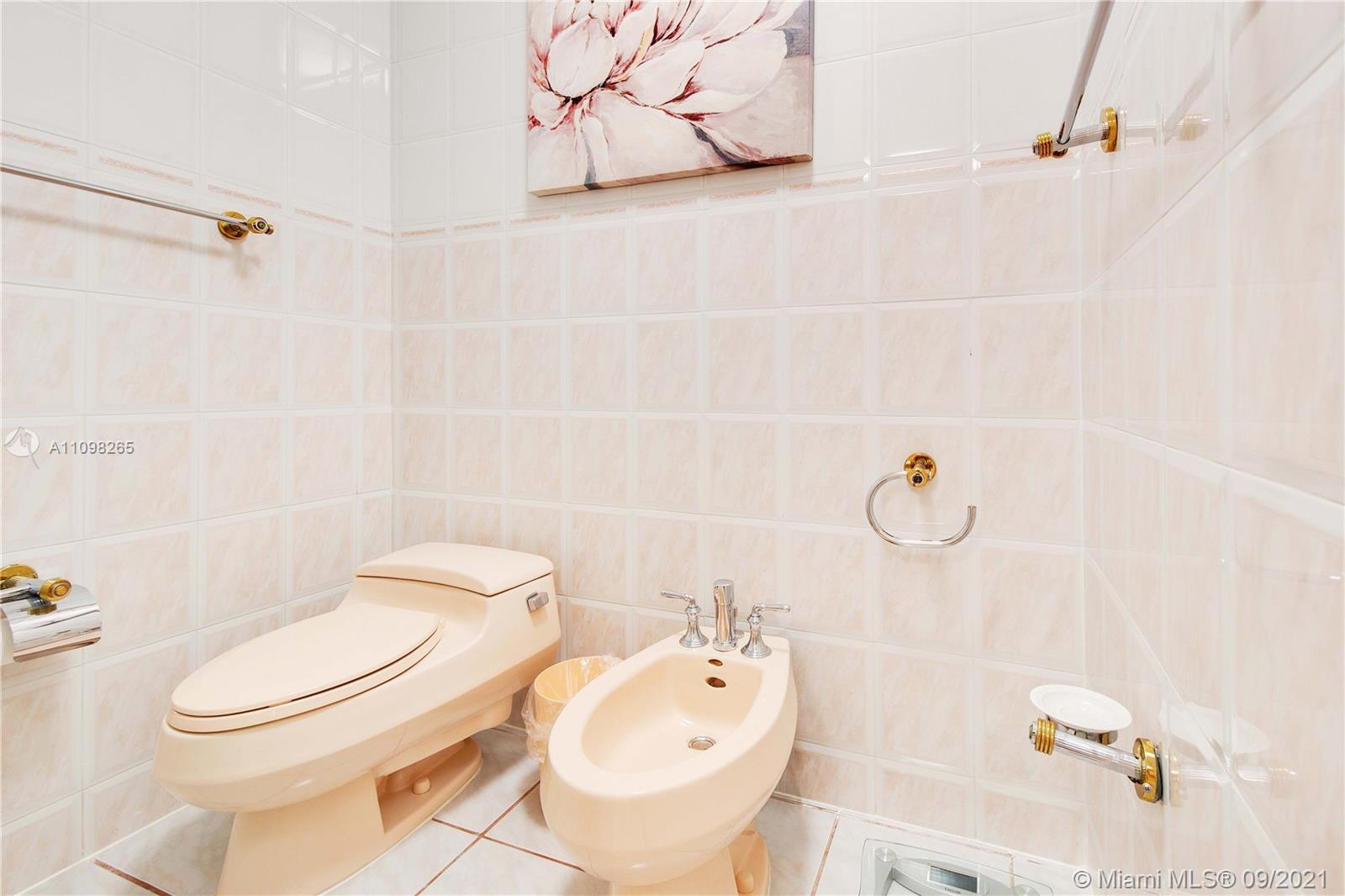 620 Southwest 22nd Road Miami, FL 33129 - Photo 26 of 53 a white toilet sitting next to a bathroom sink