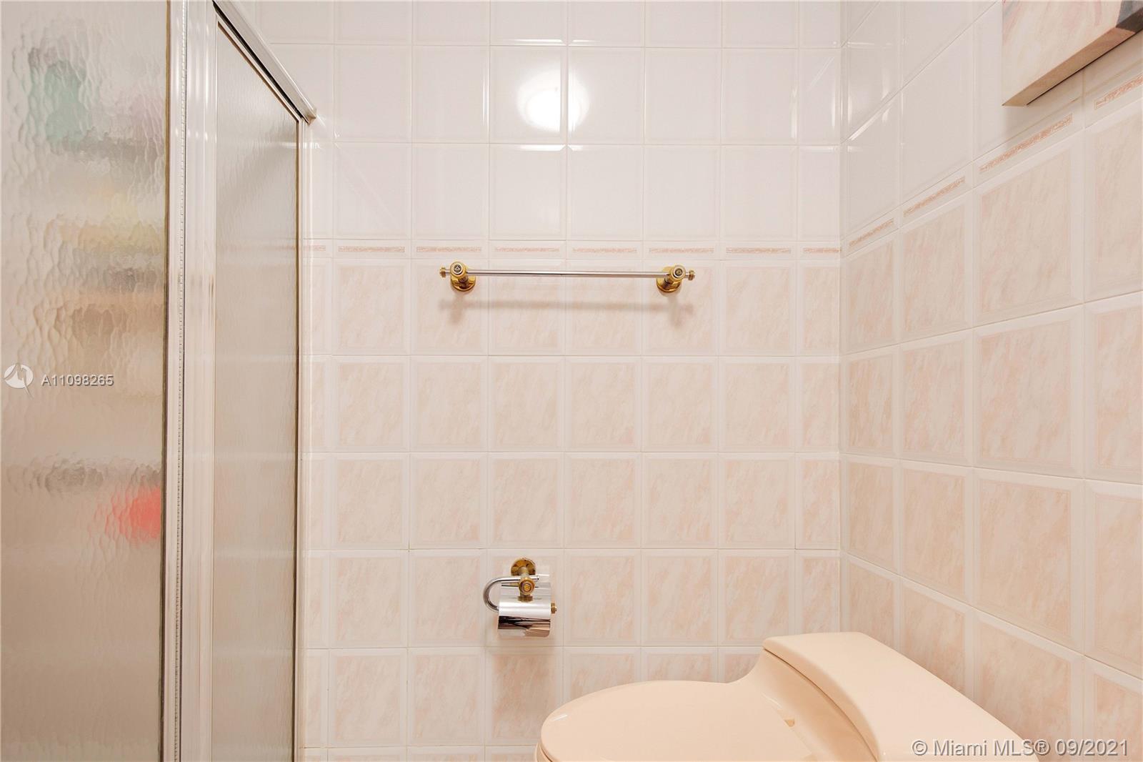 620 Southwest 22nd Road Miami, FL 33129 - Photo 27 of 53 a bathroom with a toilet and a shower