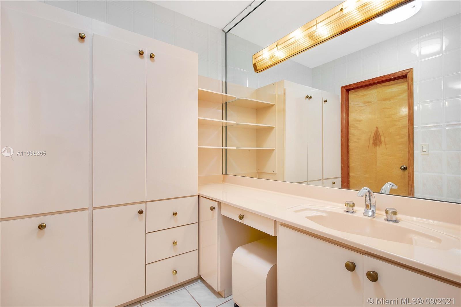 620 Southwest 22nd Road Miami, FL 33129 - Photo 28 of 53 a bathroom with a sink and a mirror