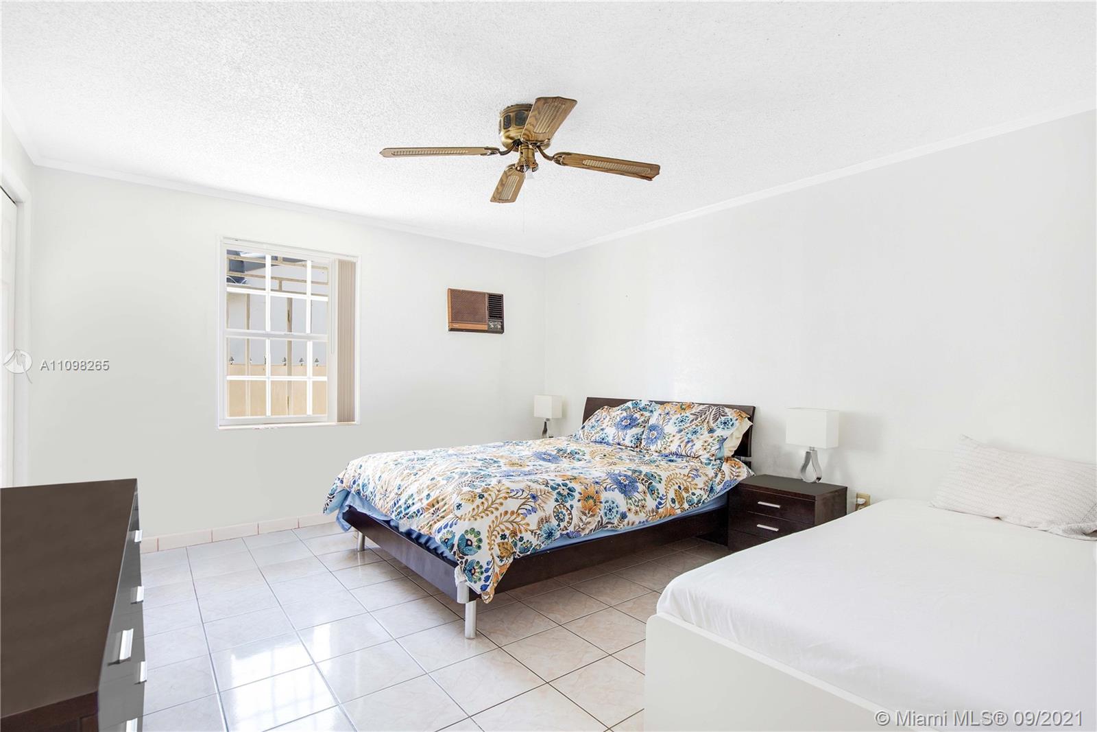 620 Southwest 22nd Road Miami, FL 33129 - Photo 31 of 53 a bedroom with two beds and window