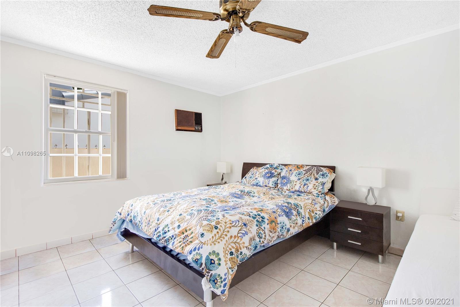 620 Southwest 22nd Road Miami, FL 33129 - Photo 32 of 53 a bedroom with a bed and a window