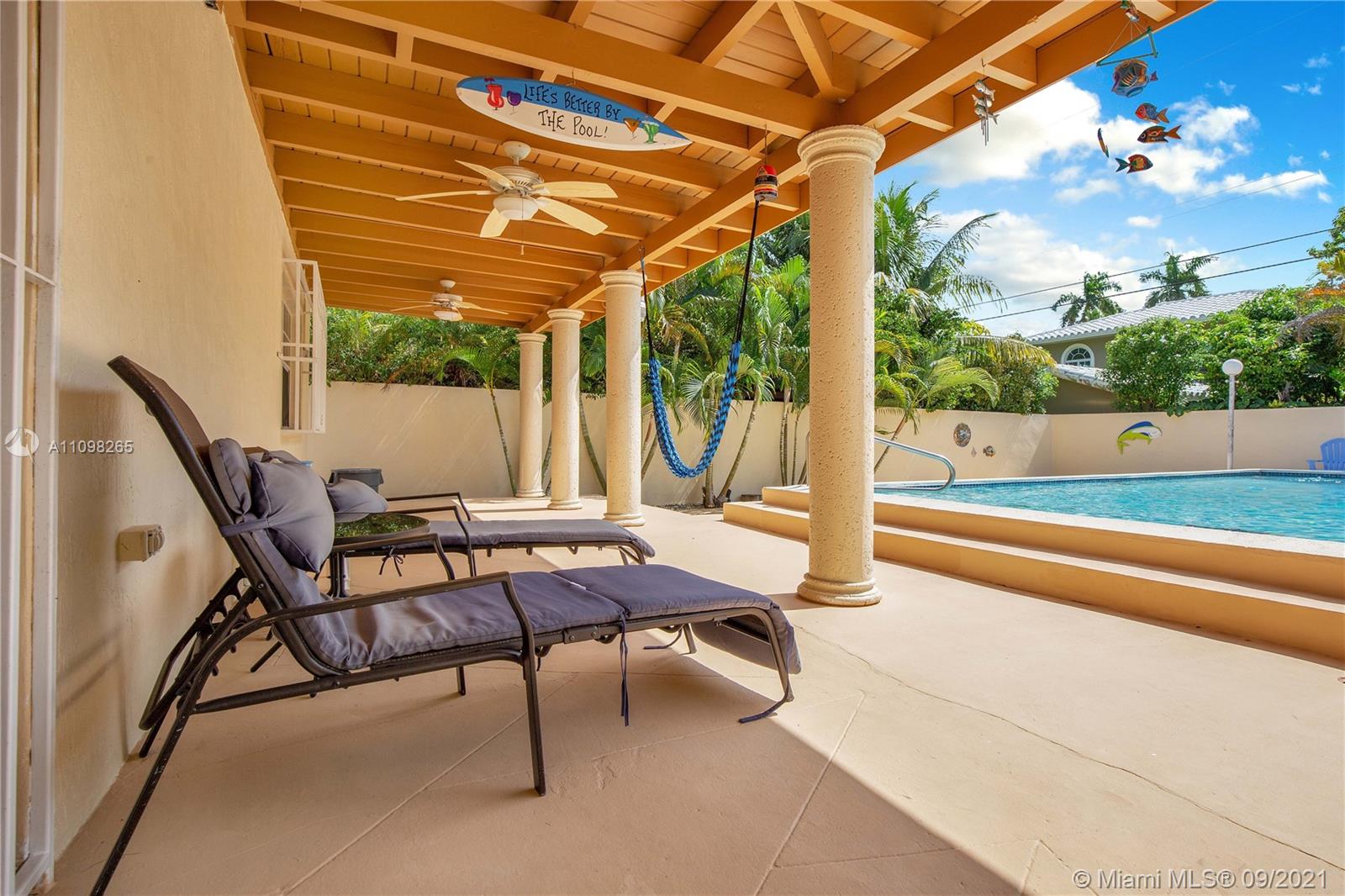 620 Southwest 22nd Road Miami, FL 33129 - Photo 37 of 53 a patio with yard glass top table and chairs