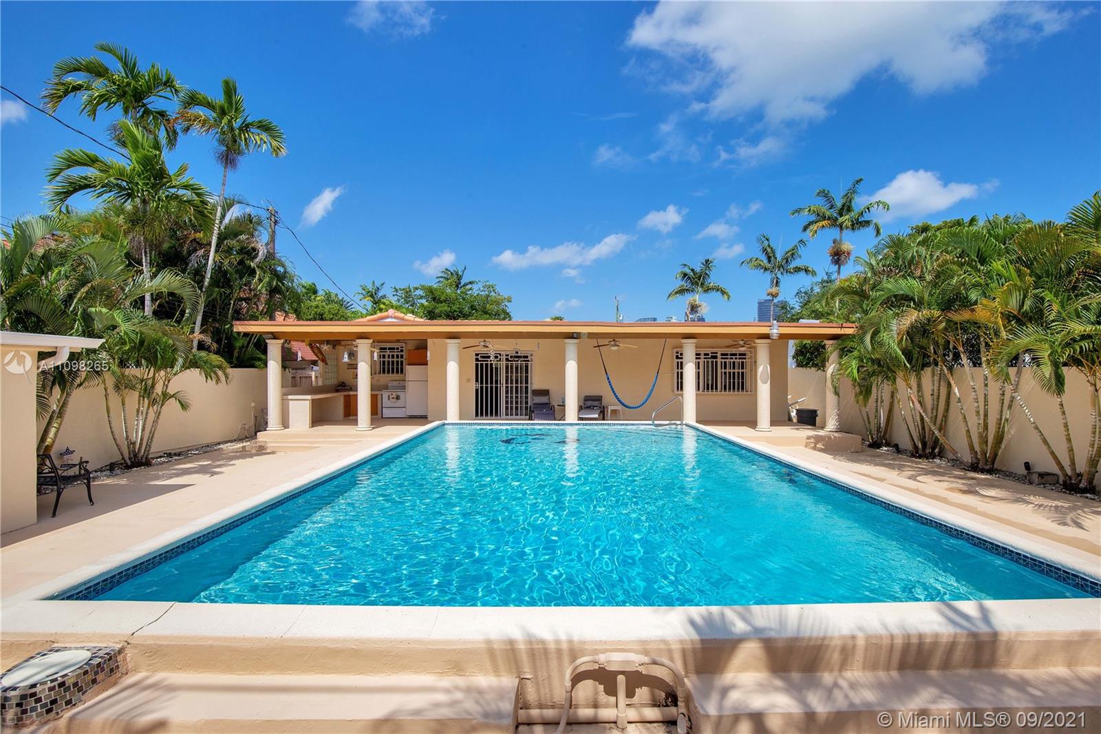 620 Southwest 22nd Road Miami, FL 33129 - Photo 40 of 53 front view of a house with a yard