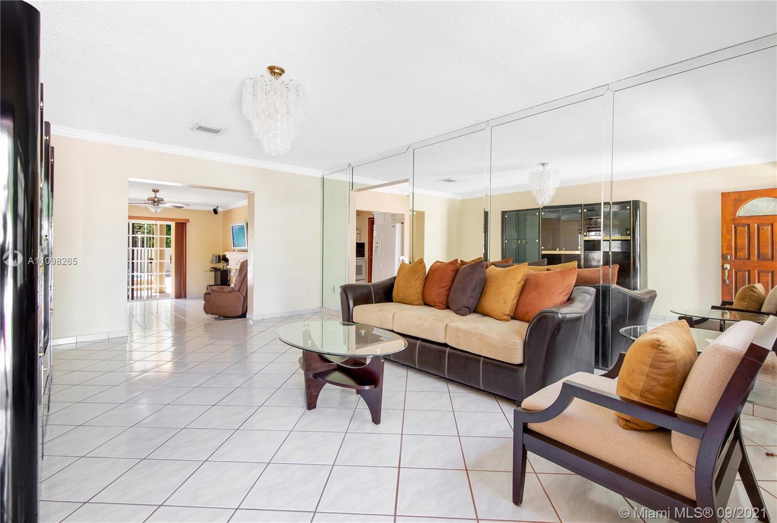 620 Southwest 22nd Road Miami, FL 33129 - Photo 6 of 53 a living room with furniture and a chandelier