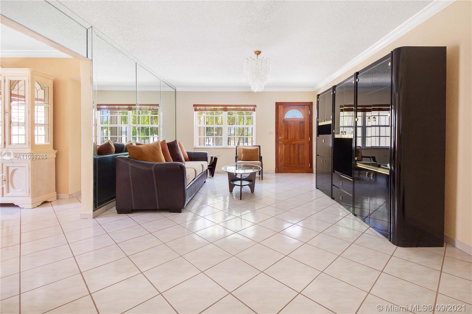 620 Southwest 22nd Road Miami, FL 33129 - Photo 7 of 53 a living room with furniture and a flat screen tv
