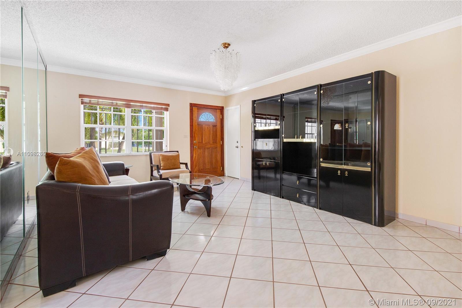 620 Southwest 22nd Road Miami, FL 33129 - Photo 8 of 53 a living room with furniture and a flat screen tv
