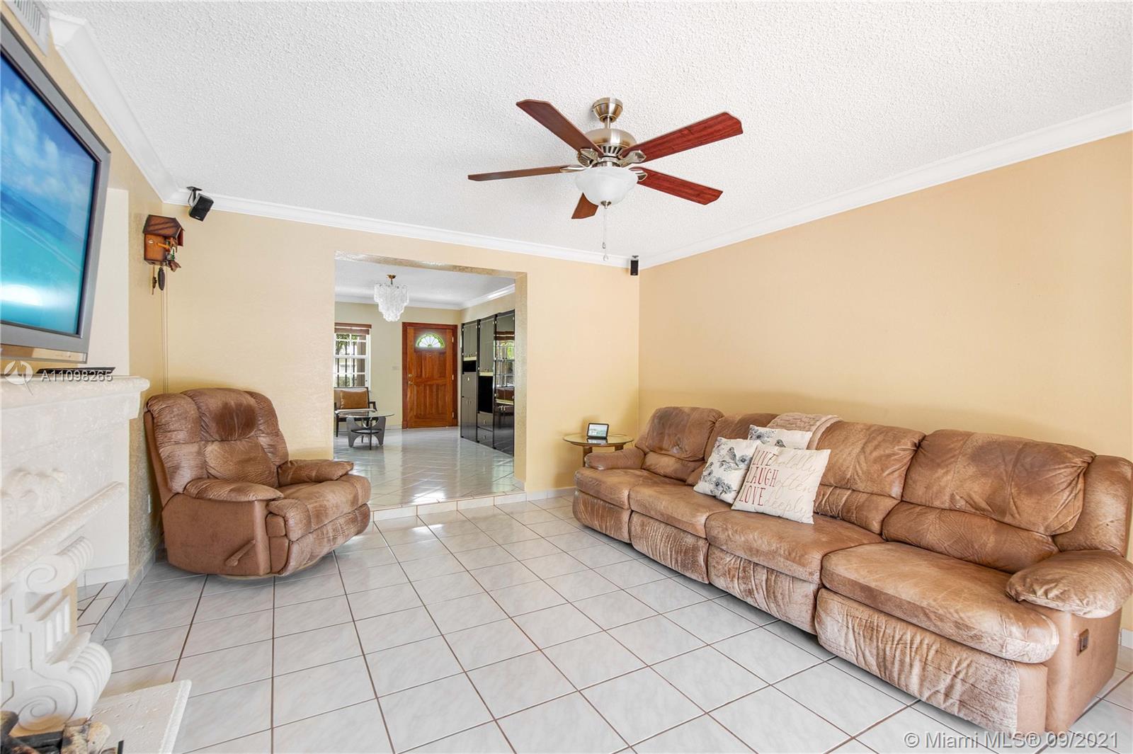 620 Southwest 22nd Road Miami, FL 33129 - Photo 9 of 53 a living room with furniture and a flat screen tv