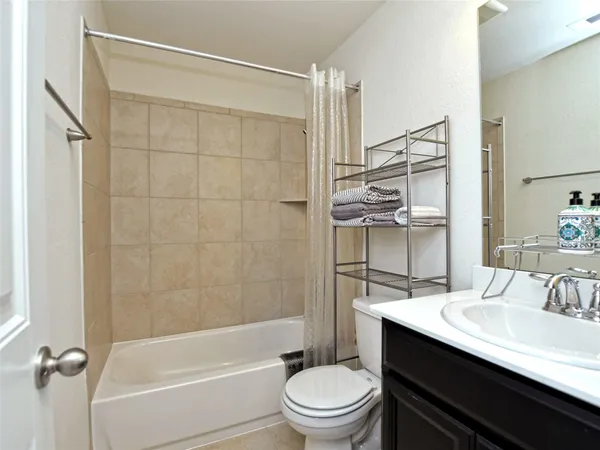 a view of workspace with window and ceiling fan