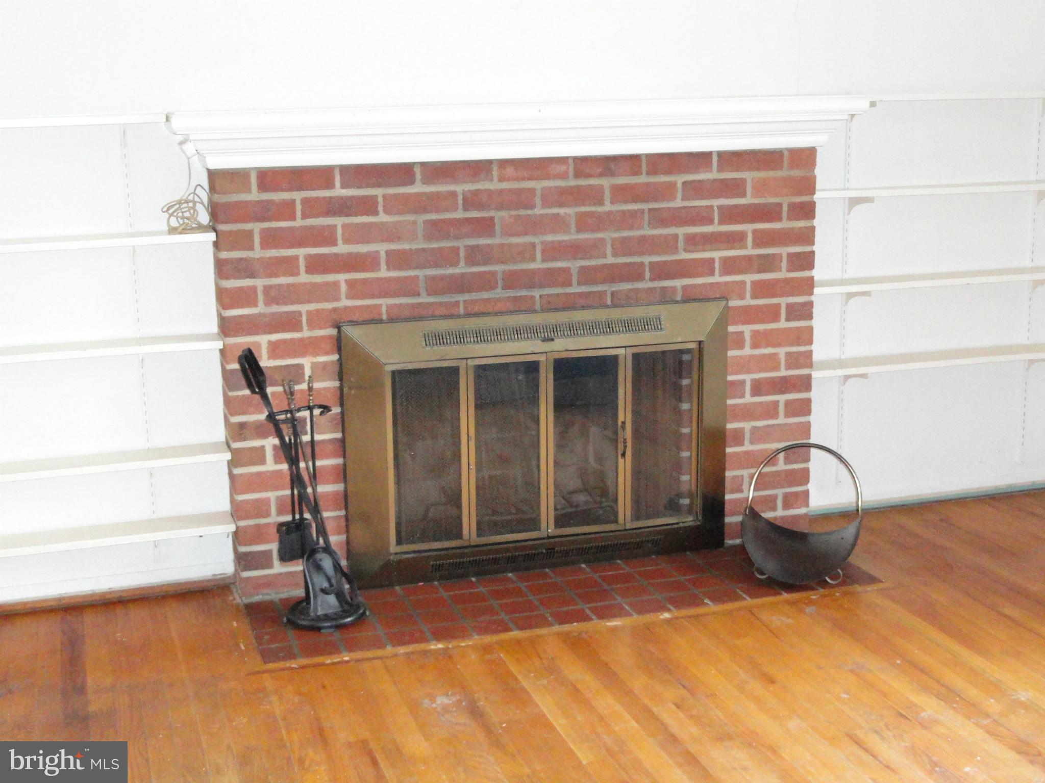 7322 Jervis Street Springfield, VA 22151 - Photo 3 of 23 Living Room brick fireplace