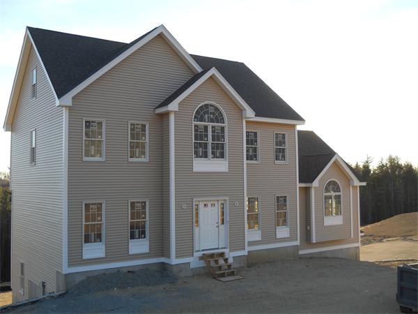 7 Quail Ridge Road Merrimac, MA 01860 - Photo 1 of 14 a front view of a house with a yard