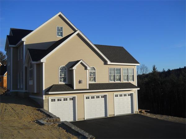 7 Quail Ridge Road Merrimac, MA 01860 - Photo 3 of 14 a front view of a house with a yard