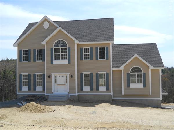 7 Quail Ridge Road Merrimac, MA 01860 - Photo 6 of 14 a front view of a house with a yard