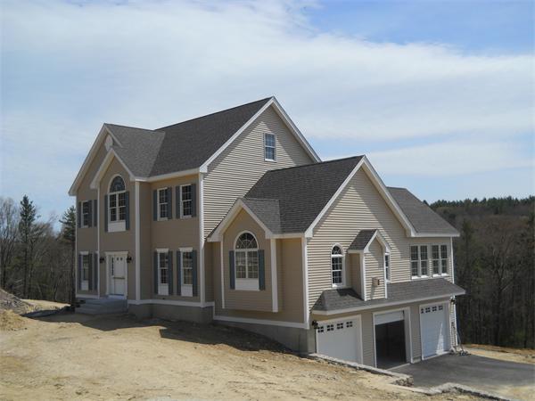 7 Quail Ridge Road Merrimac, MA 01860 - Photo 7 of 14 a view of a white house with a yard