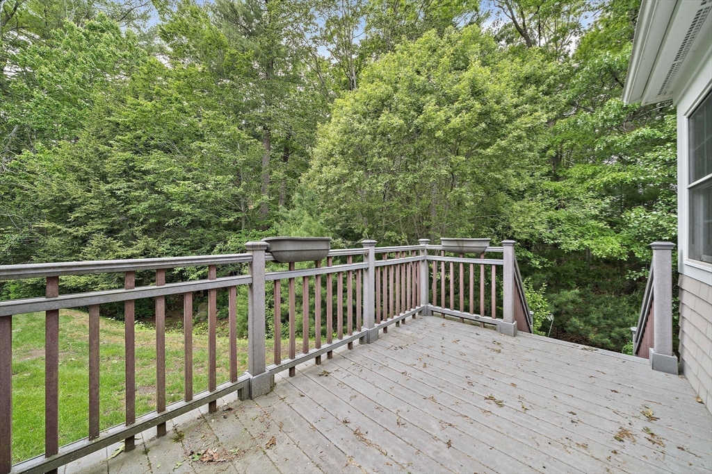 14 Sugar Maple Circle, Unit 14 Hanover, MA 02339 - Photo 32 of 38 a view of a wooden deck and a yard with green space
