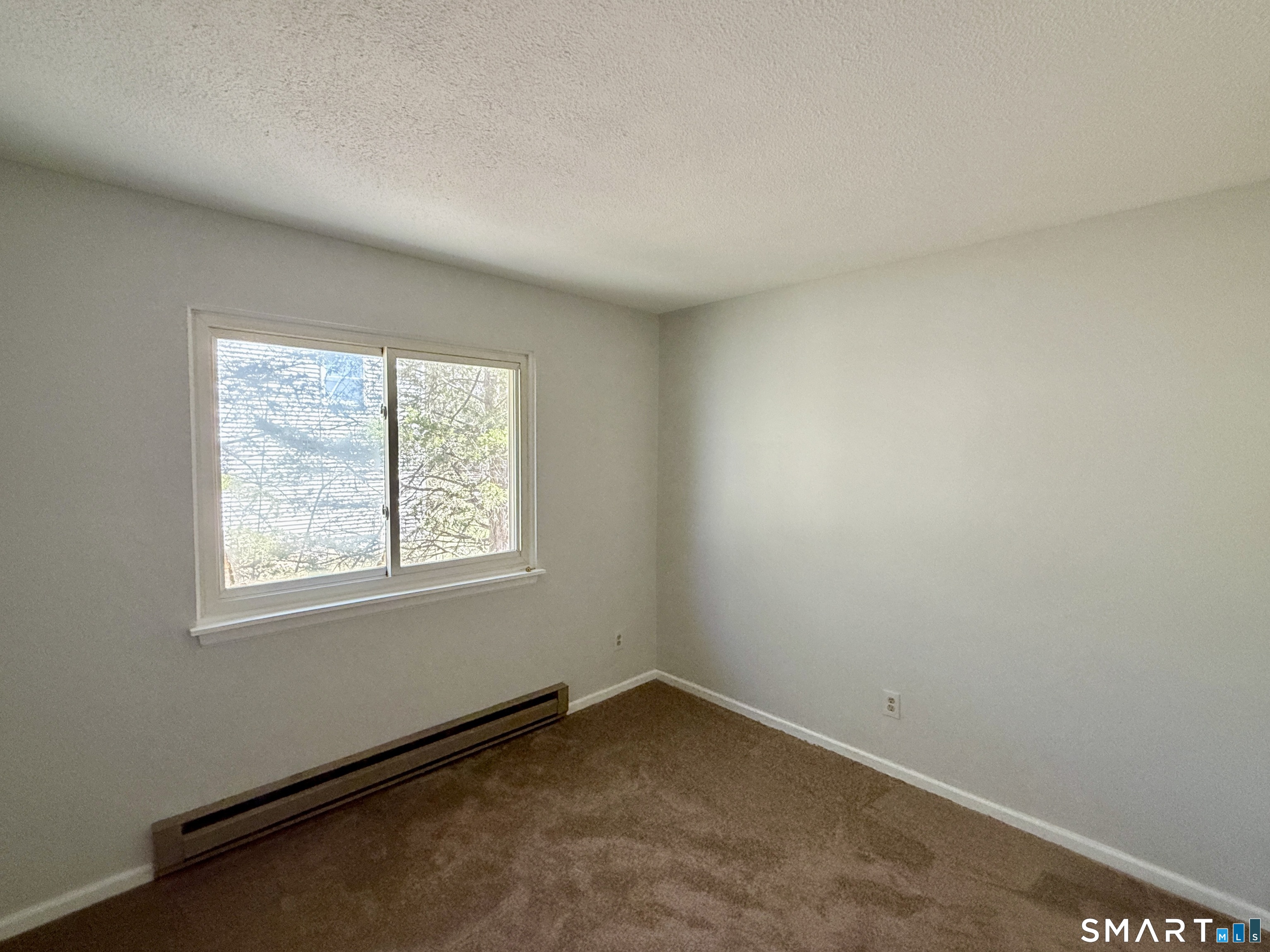 84 Wilmot Street Torrington, CT 06790 - Photo 11 of 18 an empty room with a window
