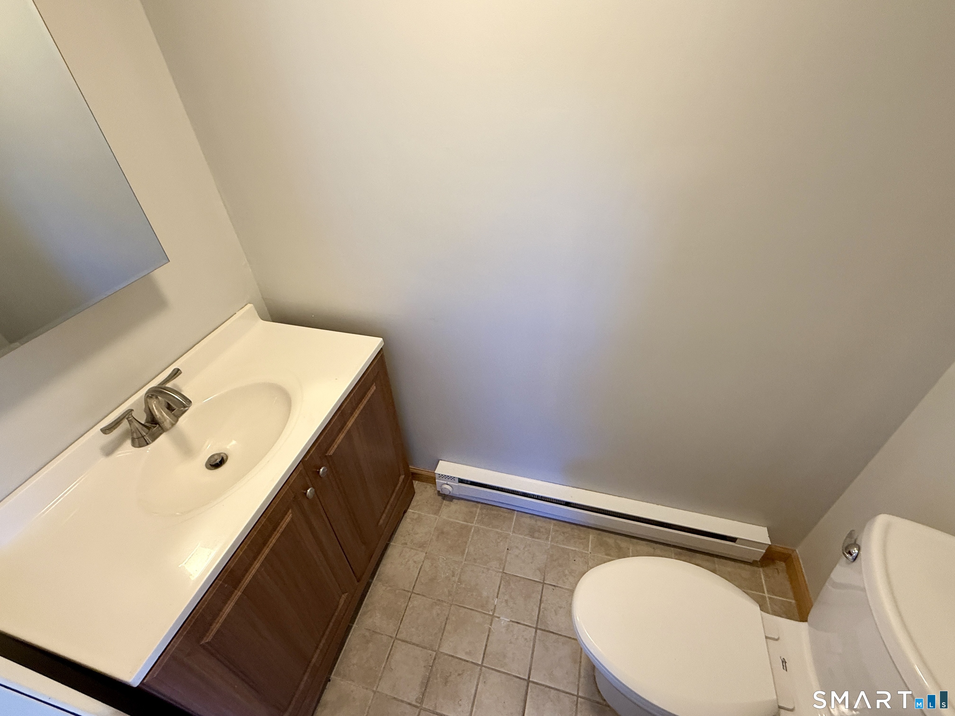 84 Wilmot Street Torrington, CT 06790 - Photo 12 of 18 a bathroom with a sink and a mirror
